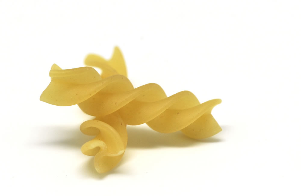 Close-up view of dry fusilli pasta