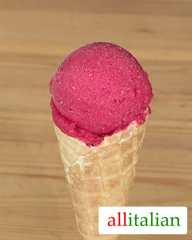 Homemade raspberry sorbet ice cream on a cone