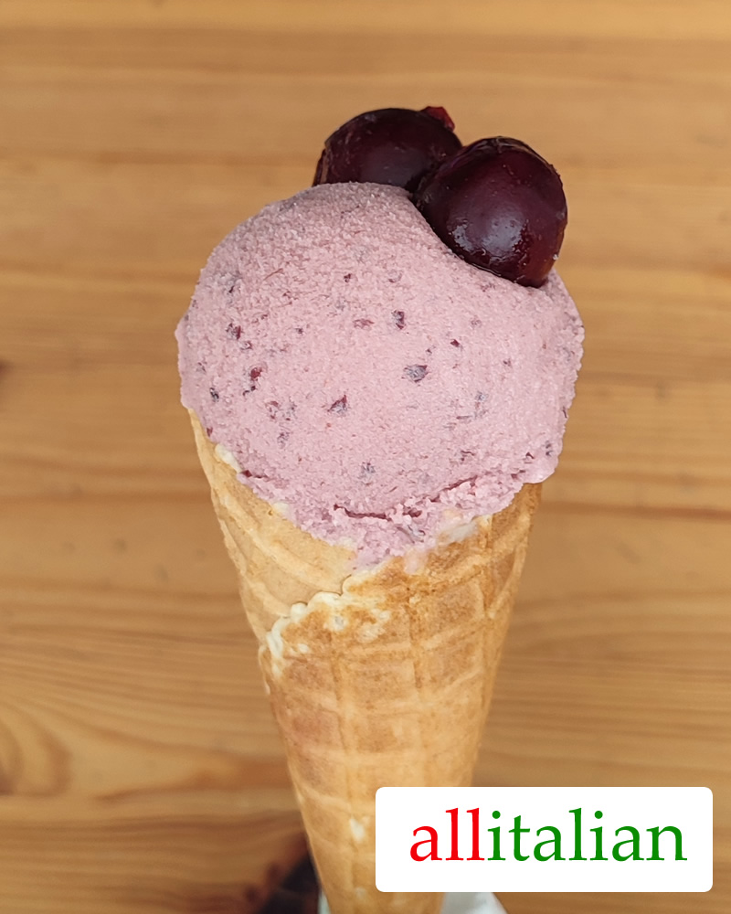 Homemade cherry ice cream on an ice cream cone