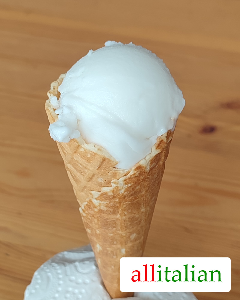 Italian homemade coconut ice cream on a cone