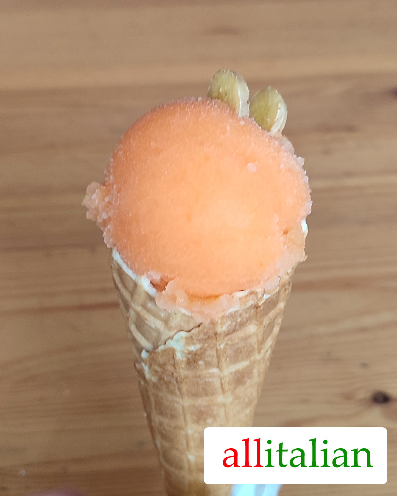 Homemade carrot-apple-ginger ice cream on a cone