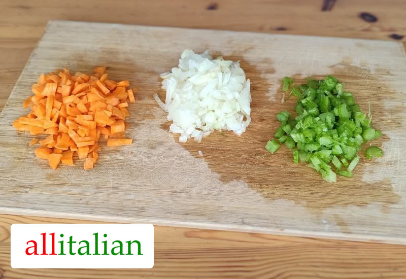 Carrots, white onion and celery: the vegetables for bolognese sauce, finely chopped