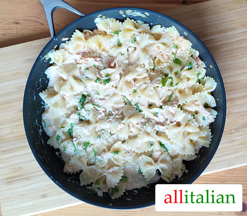 A plate farfalle with salmon made with the Italian recipe