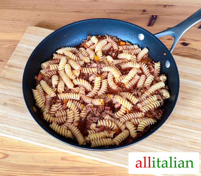 A pan of fusilli with Bolognese sauce