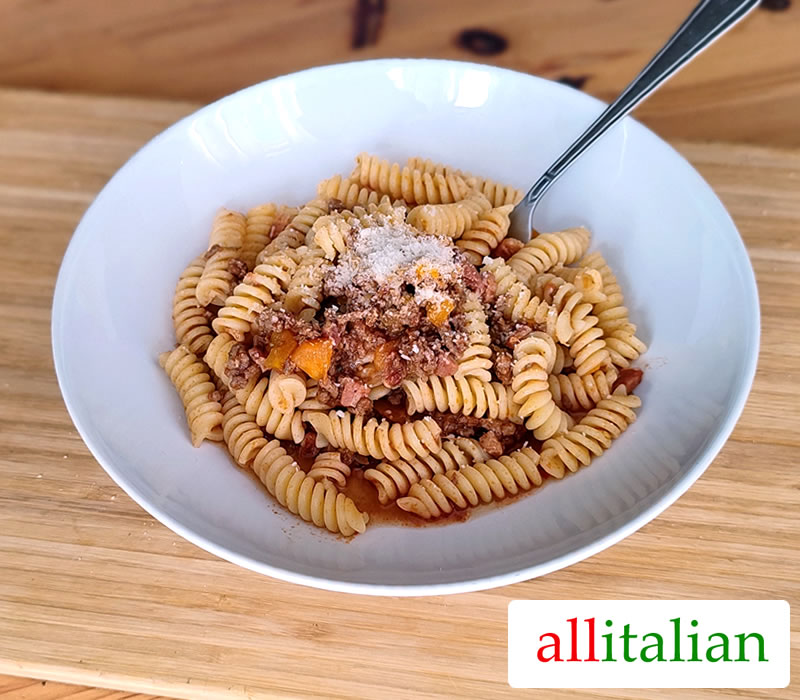 A plate fusilli with ground beef sauce made with the Italian recipe