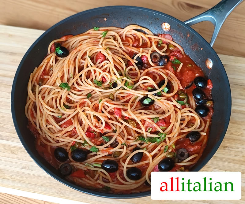 Spaghetti alla puttanesca made according to the Italian tradition