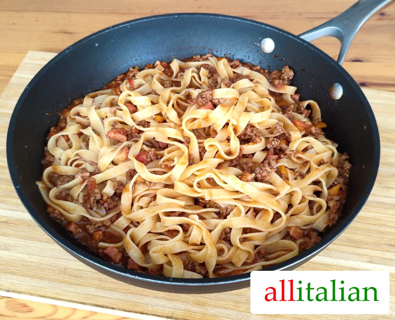 A pan of tagliatelle with Bolognese sauce
